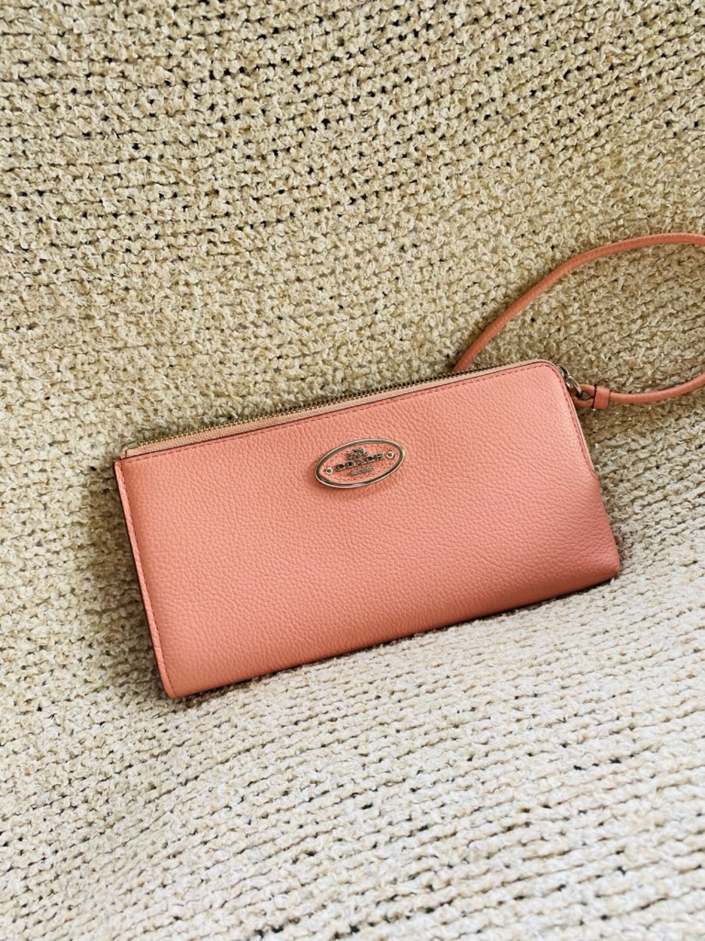 Coach Pebbled Leather Wristlet in Peach Pink